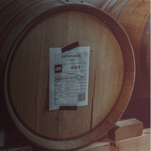 close-up of whiskey barrel with gin inside